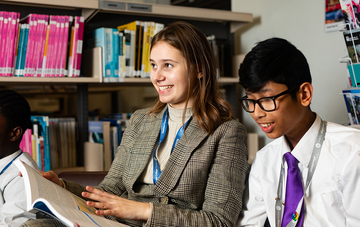 Students referencing a textbook in class