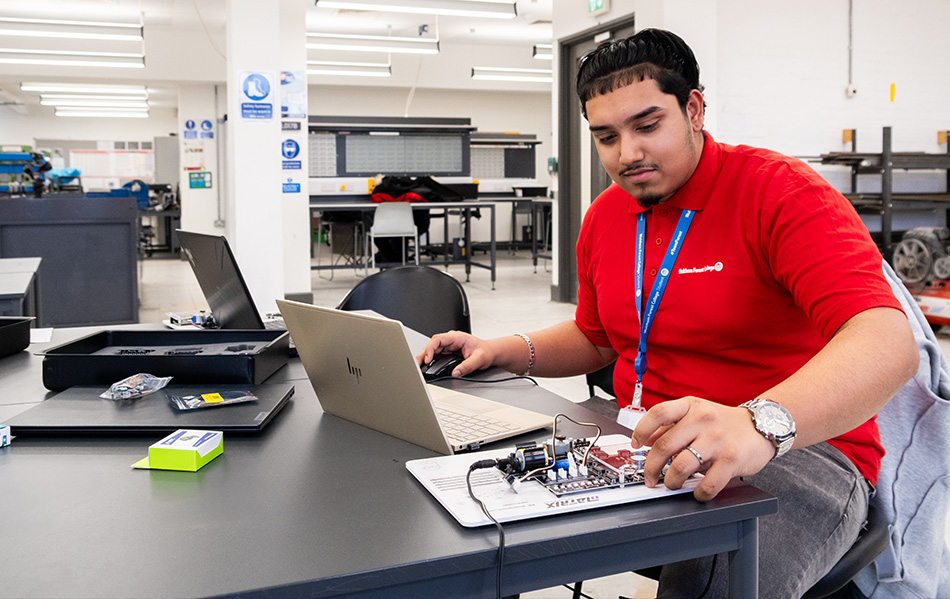 Student at a woodworking table