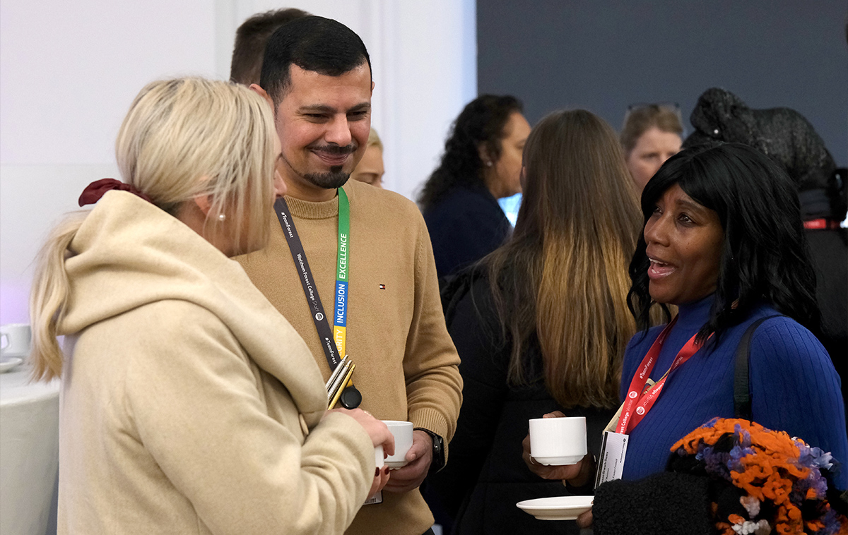 College staff talking with employer