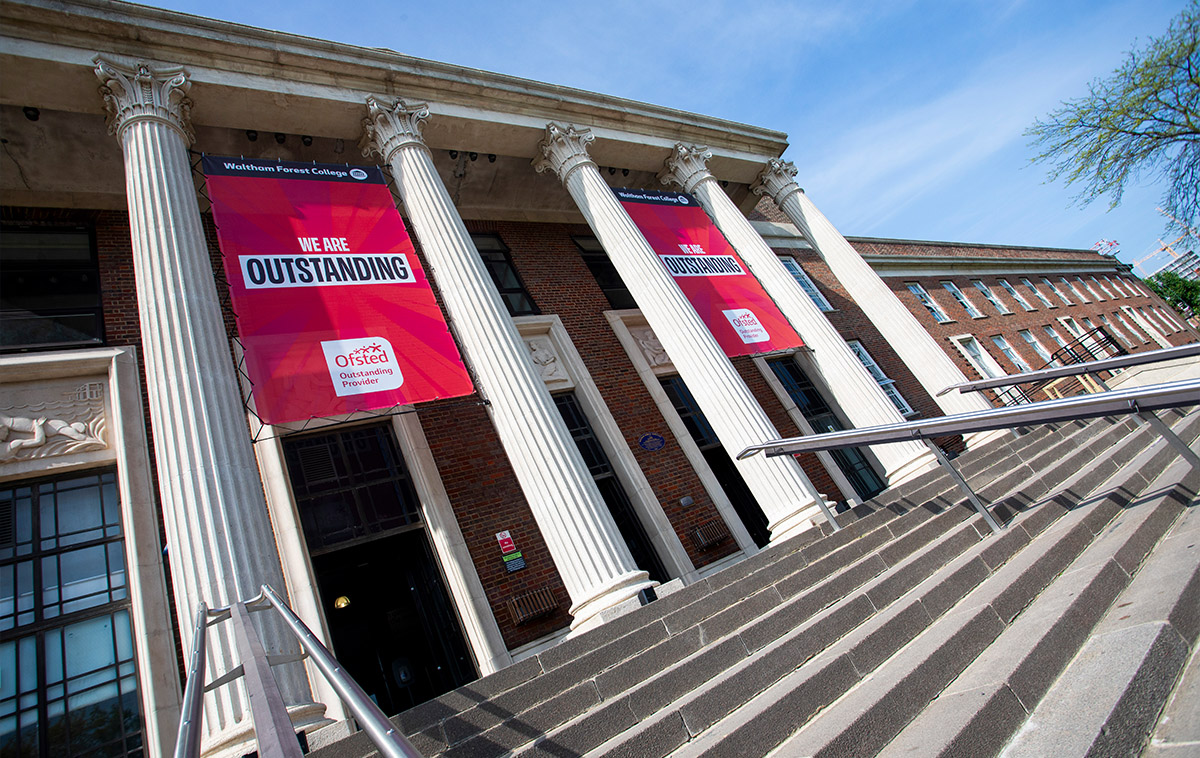 Portico of waltham forest college with Outstanding Ofsted banners