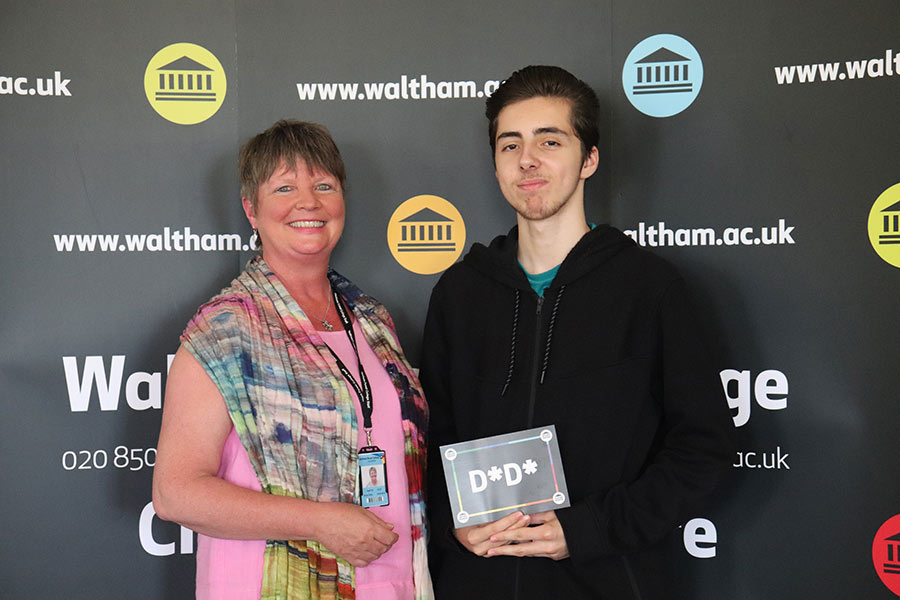 alex holding distinction certificate