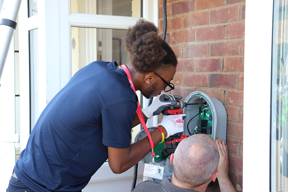 Trenay assisting with electric vehicle charger installation