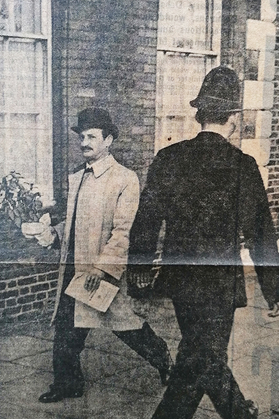 sam everton walking past policeman