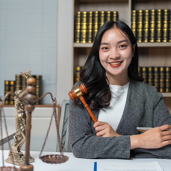 Law student holding a judges hammer
