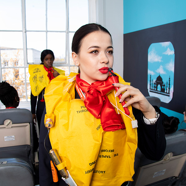 Travel and tourism student giving an instructional demo